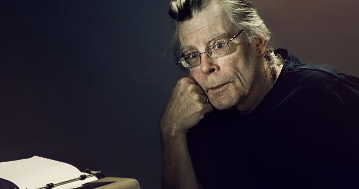 Stephen King resting his head on his hand