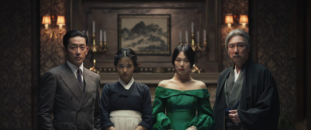 Promotional still for "The Handmaiden" featuring the four main characters standing side by side and staring at the camera