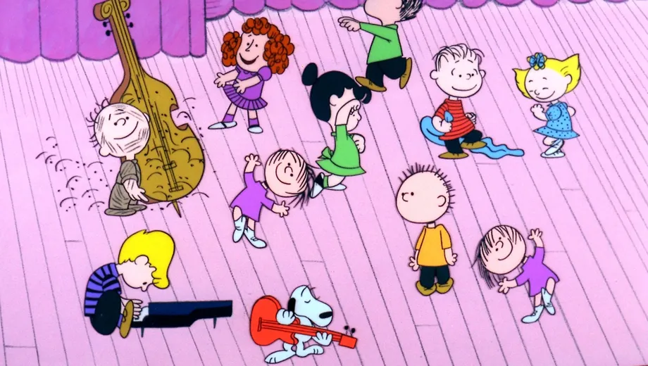 A still from "A Charlie Brown Christmas" featuring all the characters dancing