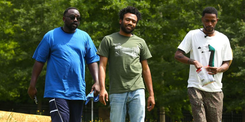 Still from "Atlanta" featuring three men walking outdoors