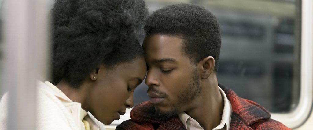 Still from "If Beale Street Could Talk" featuring a young couple leaning their foreheads against one another on the subway