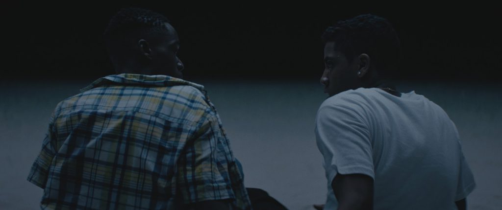 Still from "Moonlight" featuring two teenage boys gazing into each other's eyes