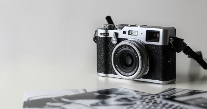 A mirrorless camera on a white background