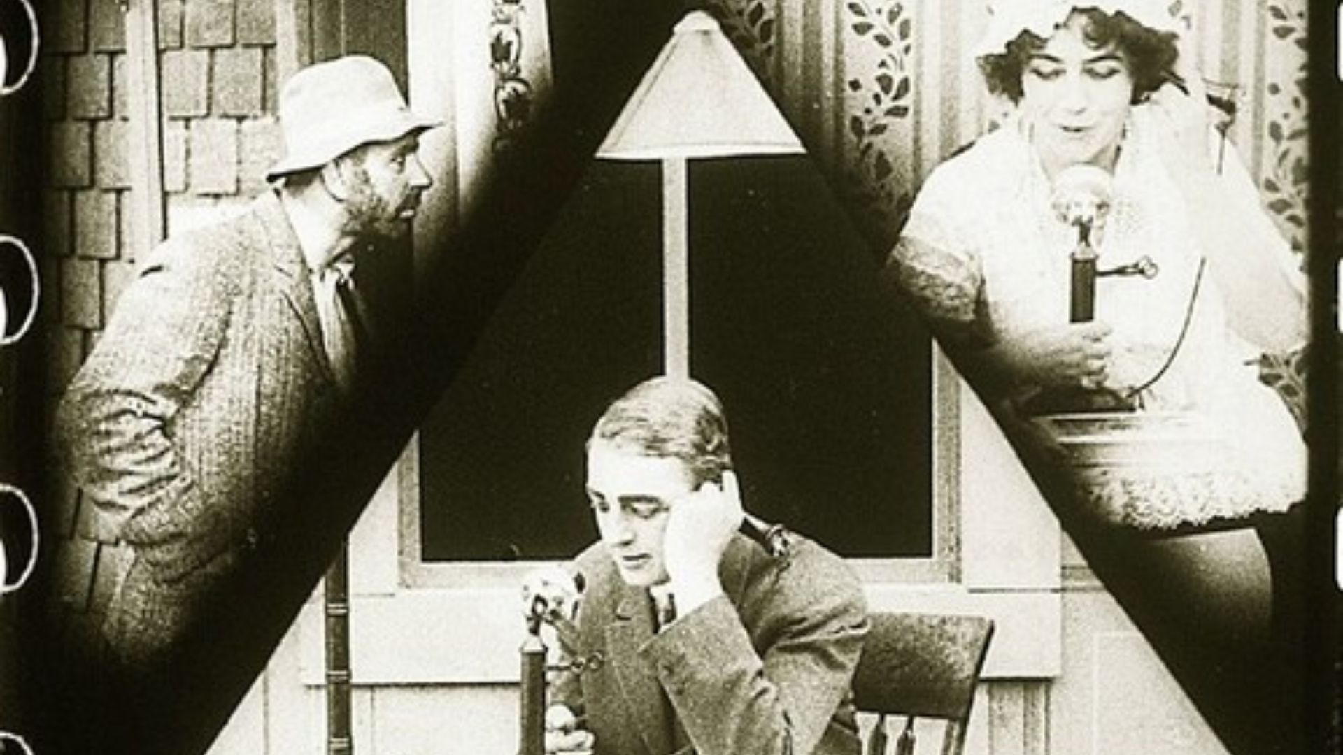 In the top left corner, a man looking at a door. In the bottom part of the picture, a man sitting at a desk, concentrated. In the top right corner, a woman holds a telephone.