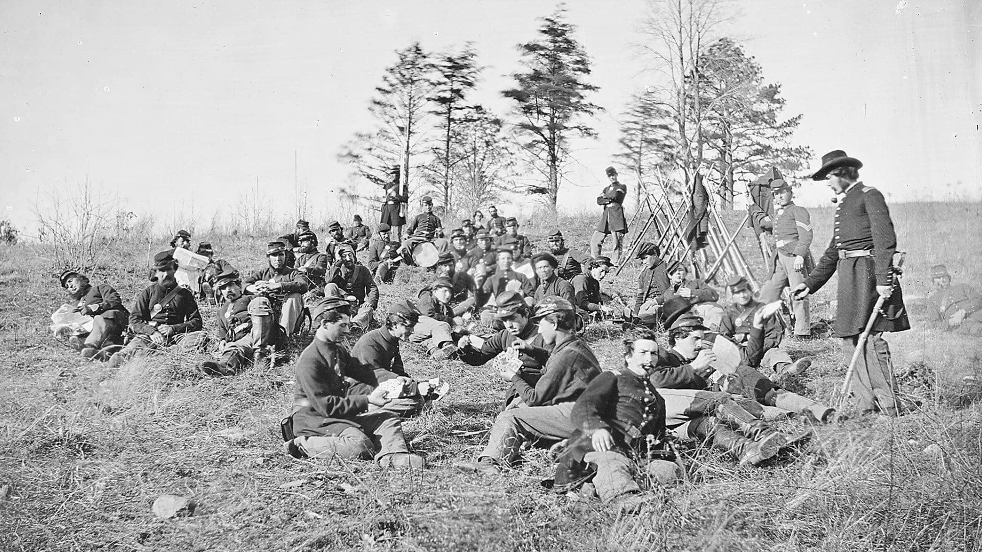 A black-and-white photo of a Civil War era military encampment.